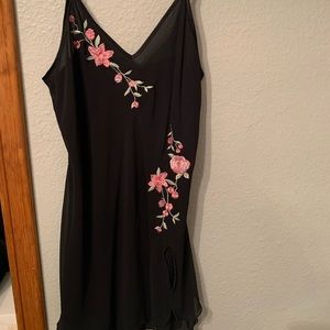 Black dress with floral touches.